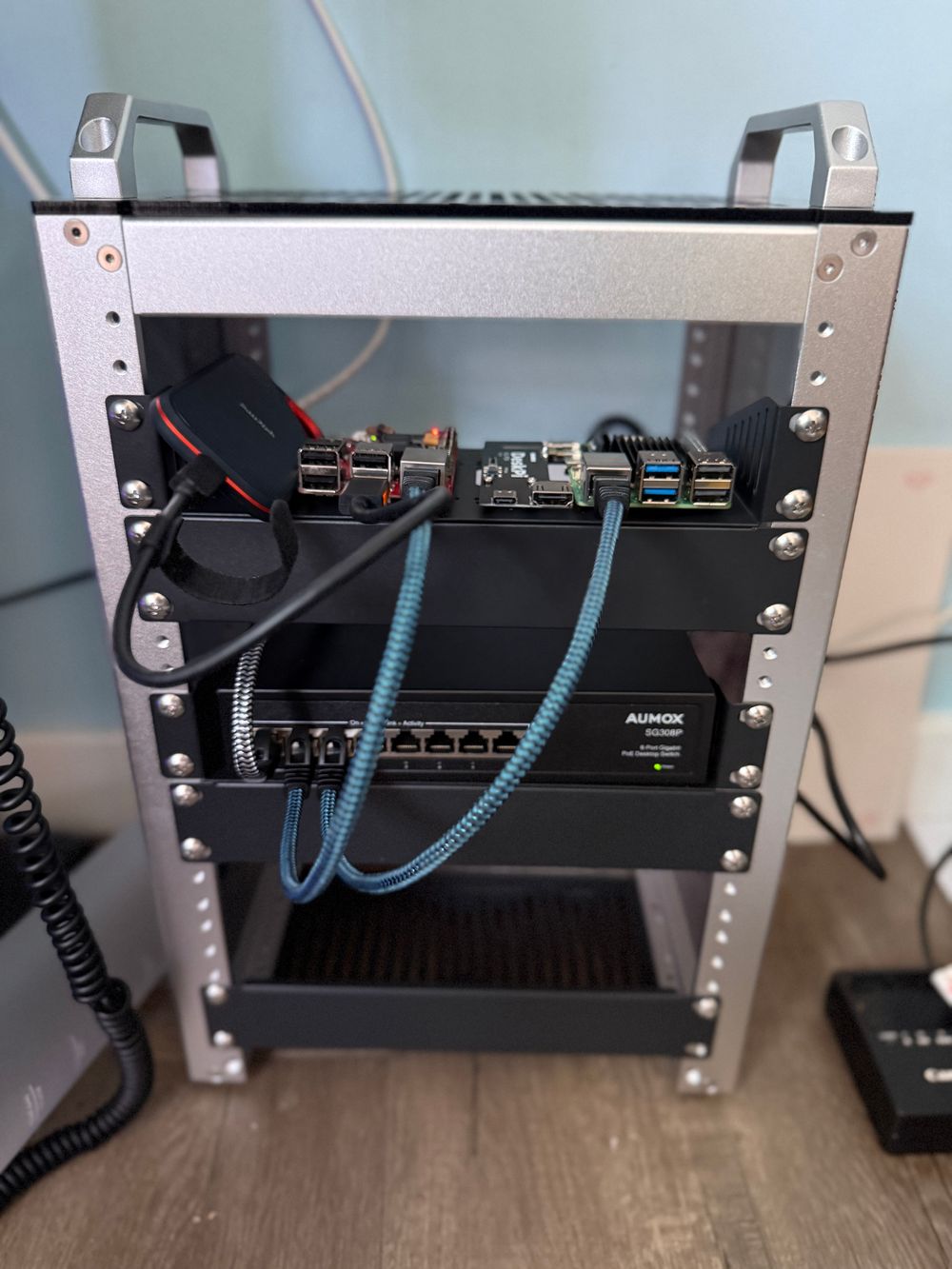 10” homelab rack with a rock pi x and a raspberry pi 5, and a gigabit PoE switch. 